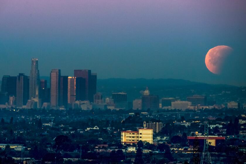 Super Blue Blood Moon sets over downtown Los Angeles 