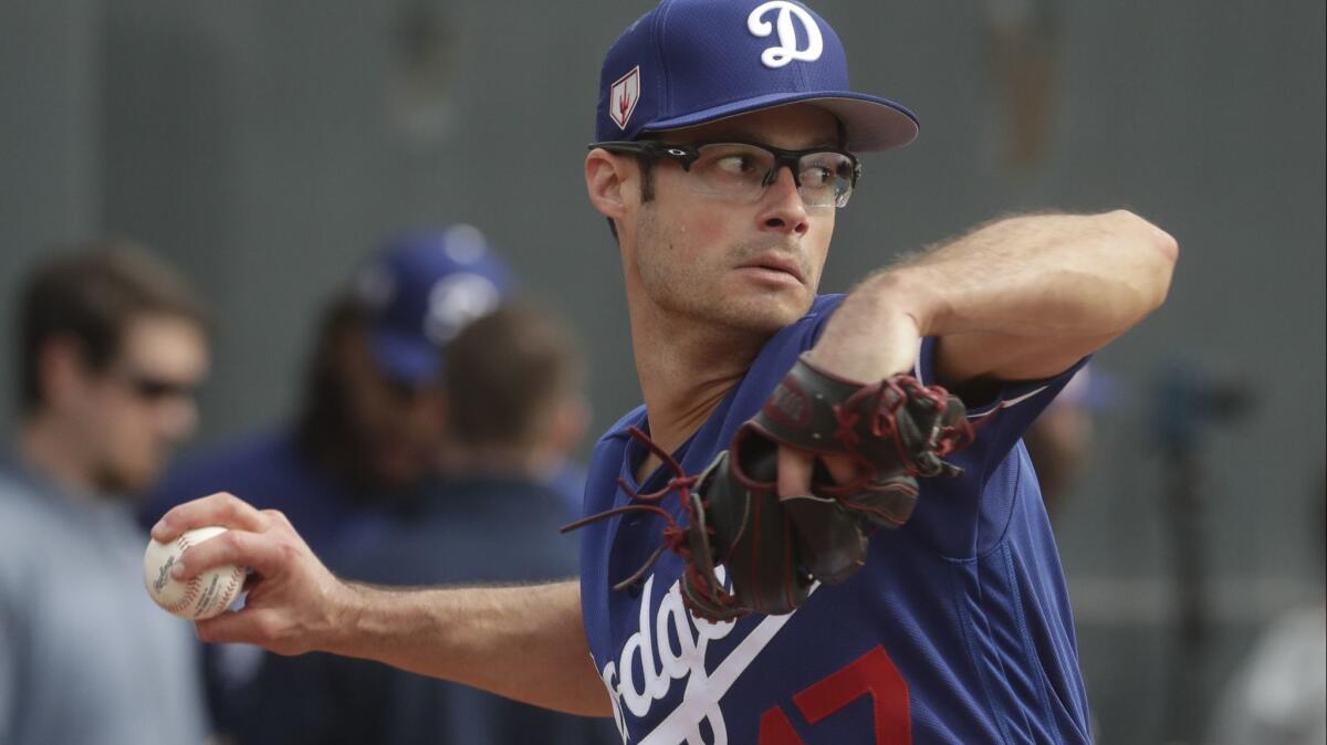 The Dodgers' Joe Kelly throws during a spring training baseball workout in Glendale, Ariz., on Feb. 13.