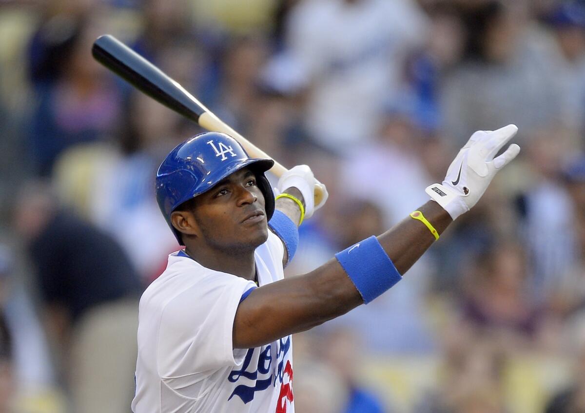 Dodgers right fielder Yasiel Puig hits a solo home run against the San Francisco Giants on Monday.