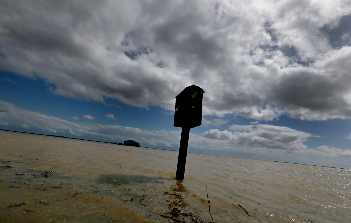 A mailbox stands in floodwaters near Corcoran, Calif. 