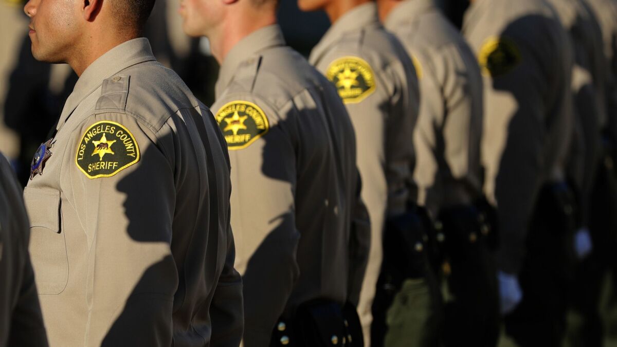 The California Supreme Court heard arguments Wednesday in a case that will decide whether law enforcement officials may give to prosecutors the names of deputies and officers who have committed misconduct. Above, L.A. sheriff's deputies stand at their graduation ceremony in 2017.