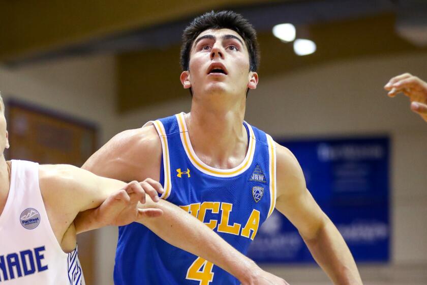 LAHAINA, HI - NOVEMBER 26: Tyler Cartaino #13 of the Chaminade Silverswords and Jaime Jaquez Jr. #4 of the UCLA Bruins battle for position during a free throw attempt during the second half at the Lahaina Civic Center on November 26, 2019 in Lahaina, Hawaii. (Photo by Darryl Oumi/Getty Images)