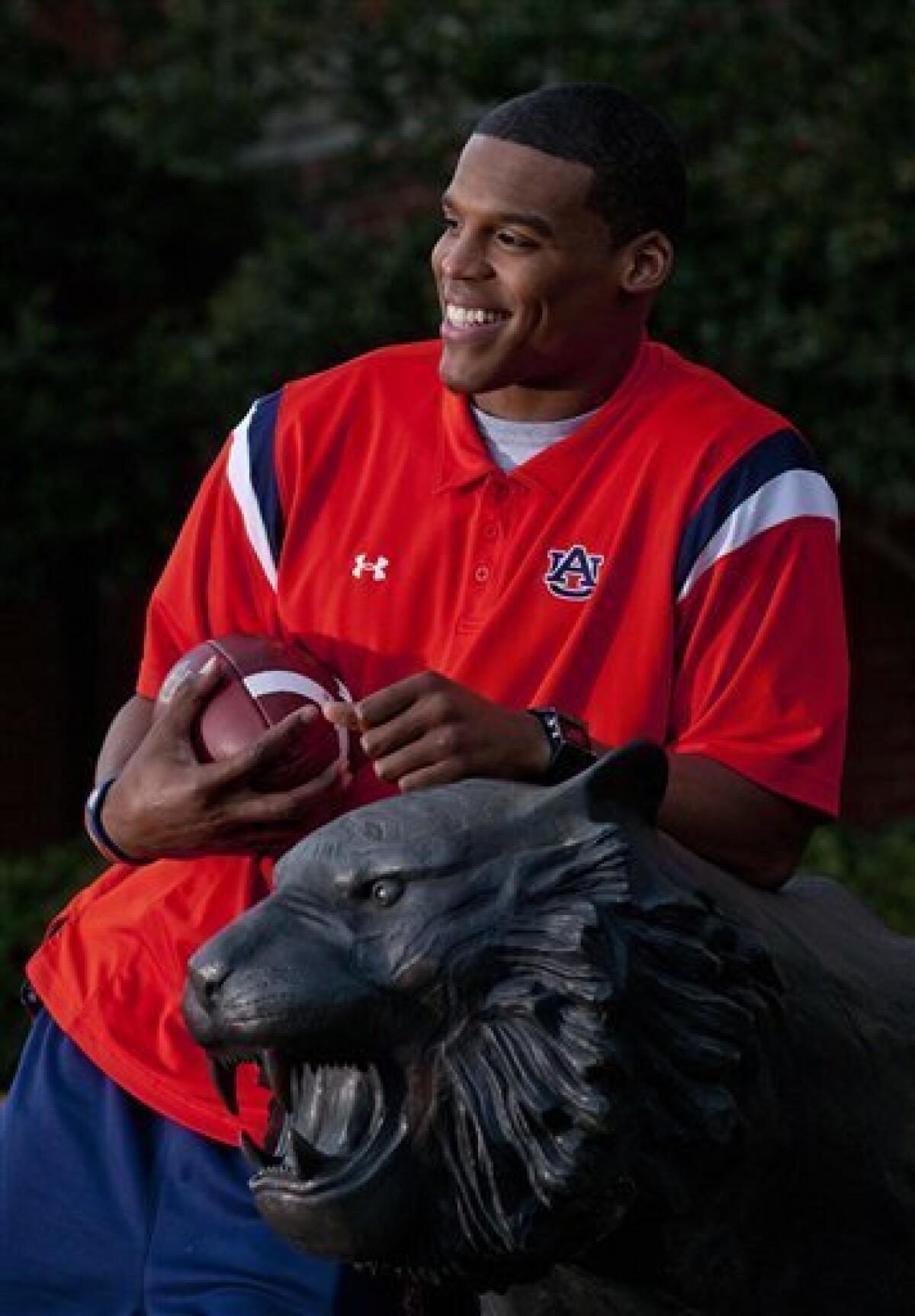 Auburn QB Cam Newton wins the Heisman Trophy 