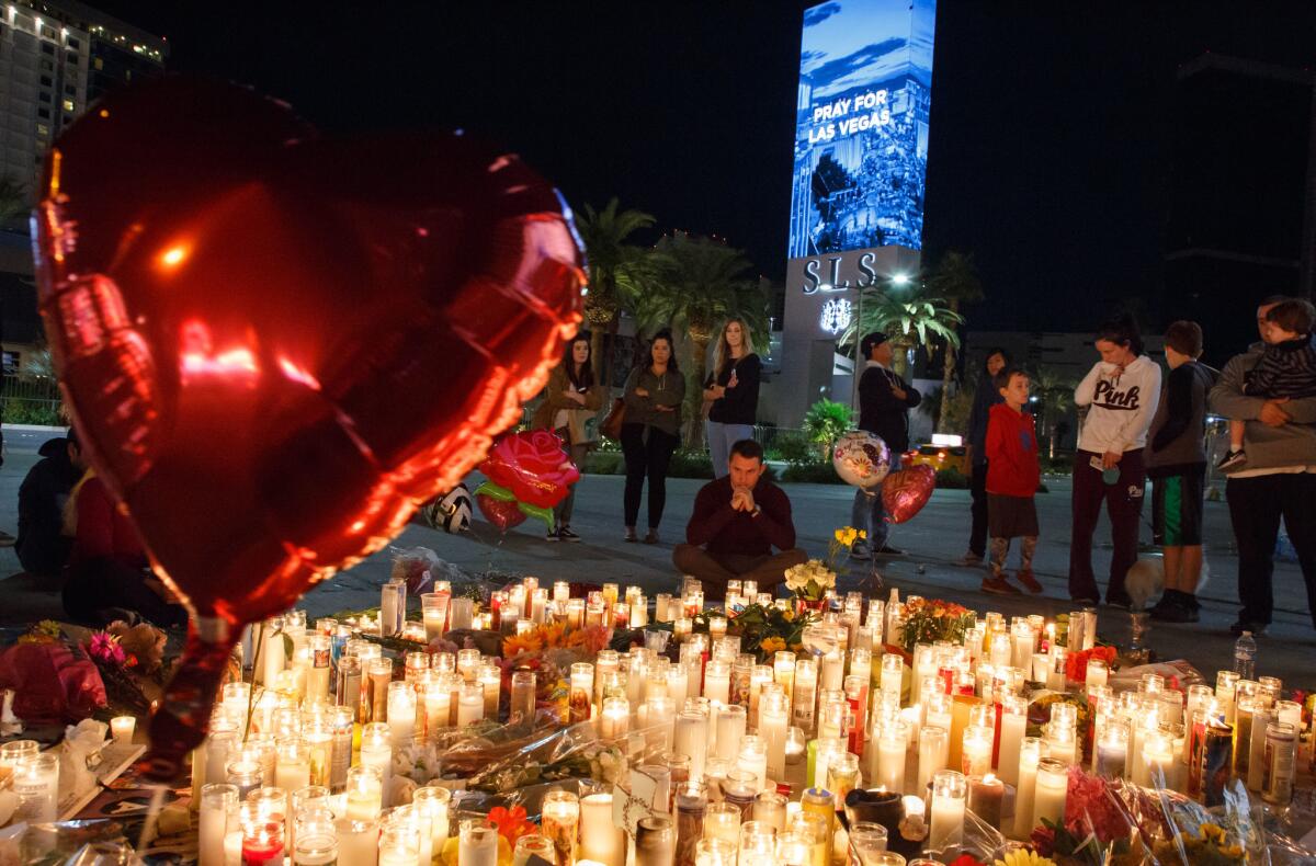 Mourners pay tribute to the Las Vegas shooting victims in October 2017. 