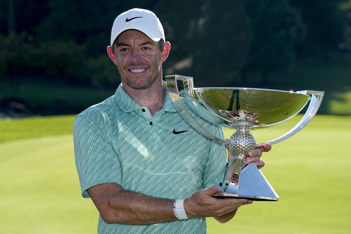 Rory McIlroy celebrates after winning the Tour Championship and his third FedEx Cup title Sunday.