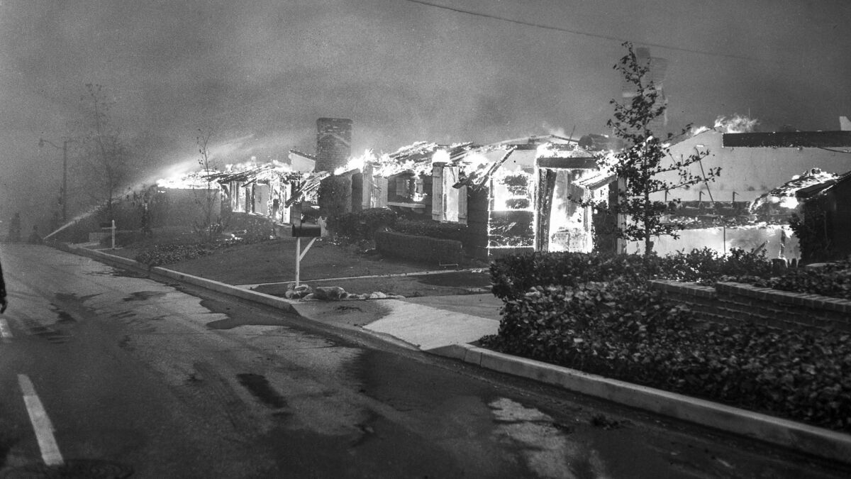 Nov. 6, 1961: Homes on Roscomare Road in Bel-Air burn during the brush fire.