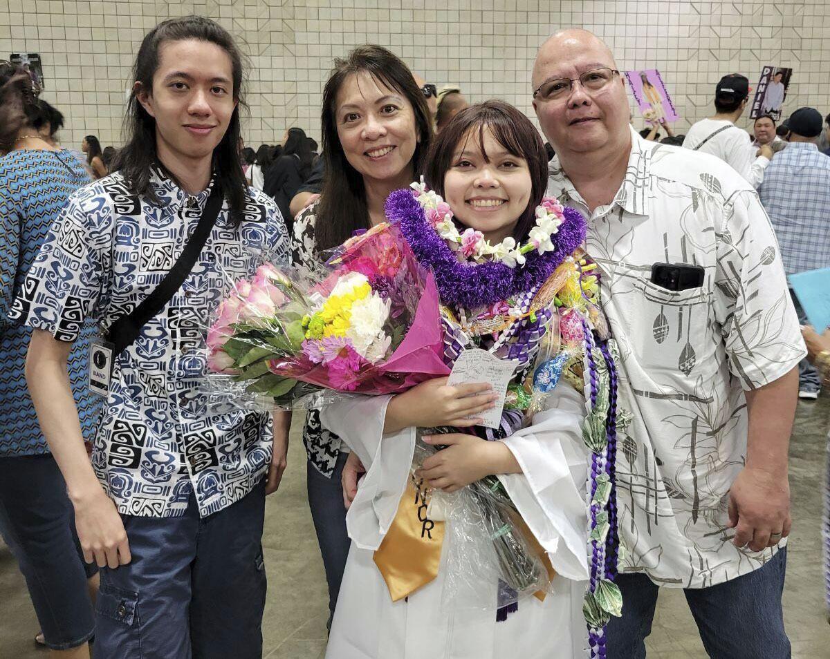 Family portrait at graduation ceremony