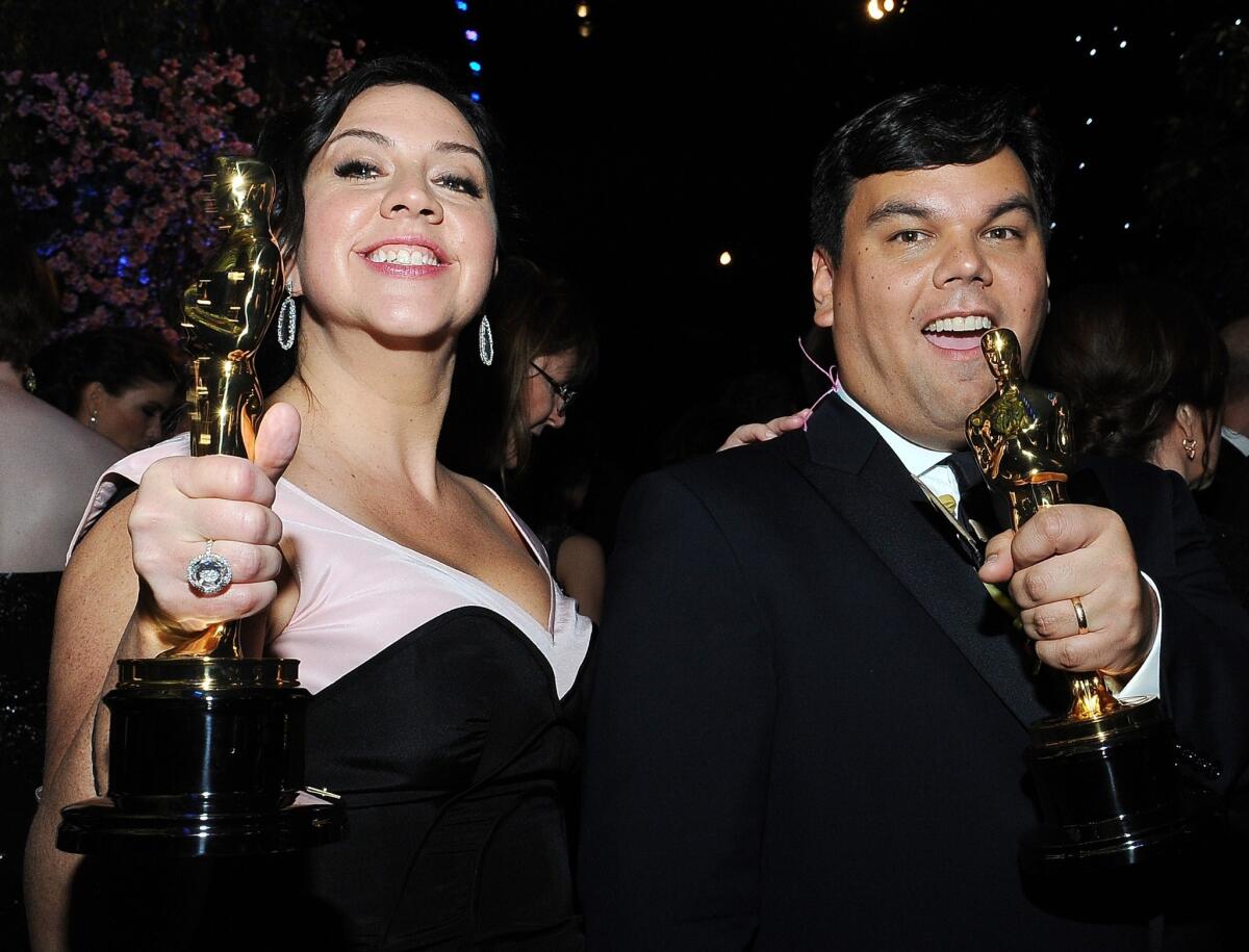 Songwriters Kristen Anderson-Lopez, left, and Robert Lopez, winners of the Oscar for original song for "Let It Go."
