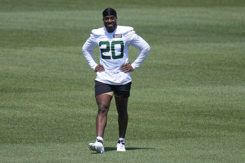New York Jets' Breece Hall works off to the side at the NFL football team's training facility in Florham Park, N.J., Wednesday, May 31, 2023. (AP Photo/Seth Wenig)