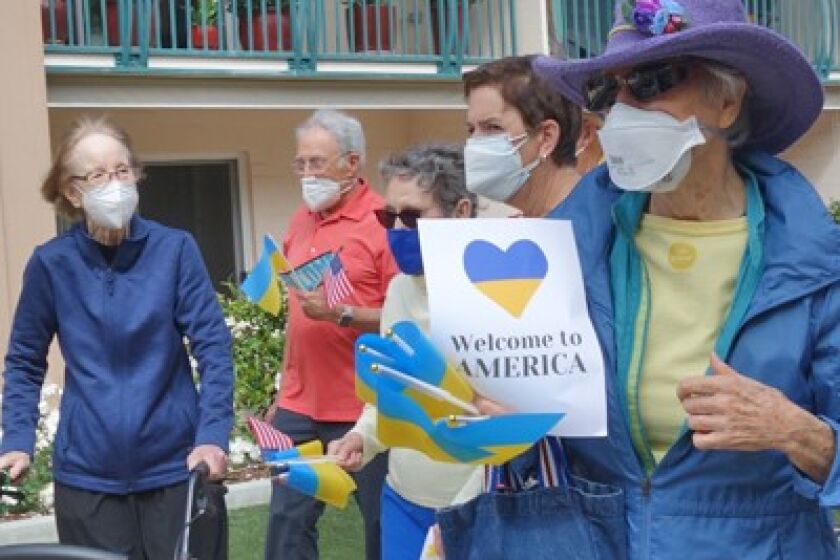 Residents of White Sands retirement community greet a family that moved to La Jolla after fleeing Ukraine.