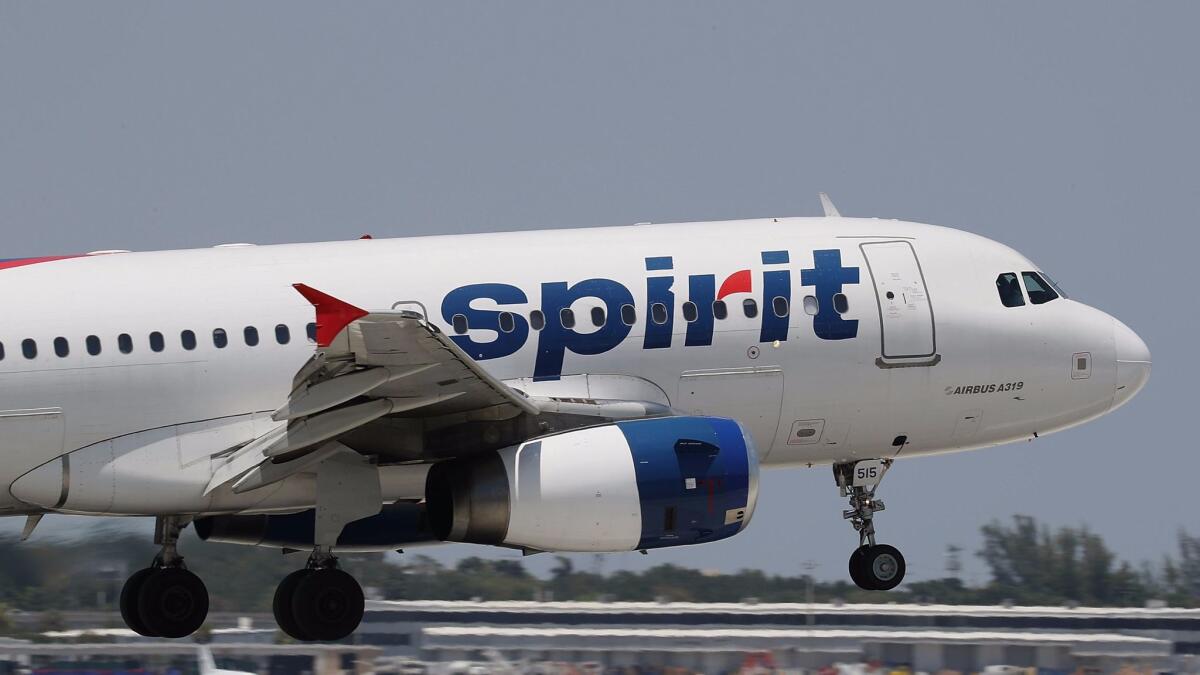 A Spirit Airlines plane lands at the Fort Lauderdale-Hollywood International Airport in Florida.