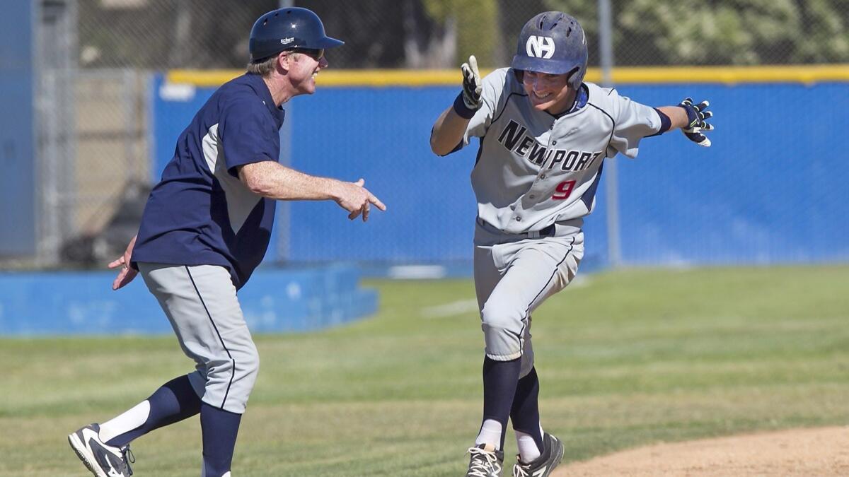 Newport Harbor High's John Olmstead (9), shown rounding third base on March 29, 2017, hit a solo home run to beat Fountain Valley 2-1 in extra innings on Tuesday.