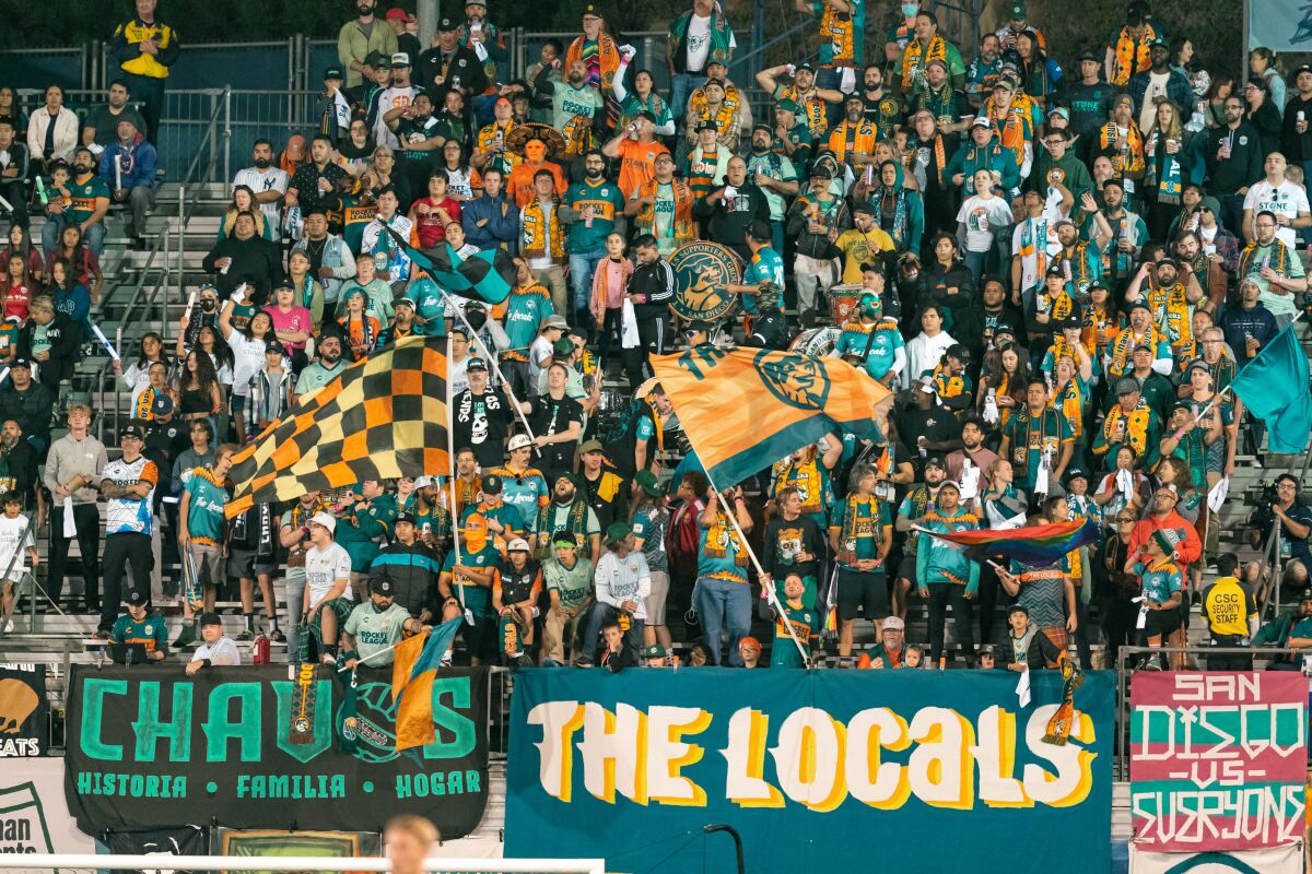 The Locals, an independent support group of the San Diego Loyal, cheer on the soccer team at a game.