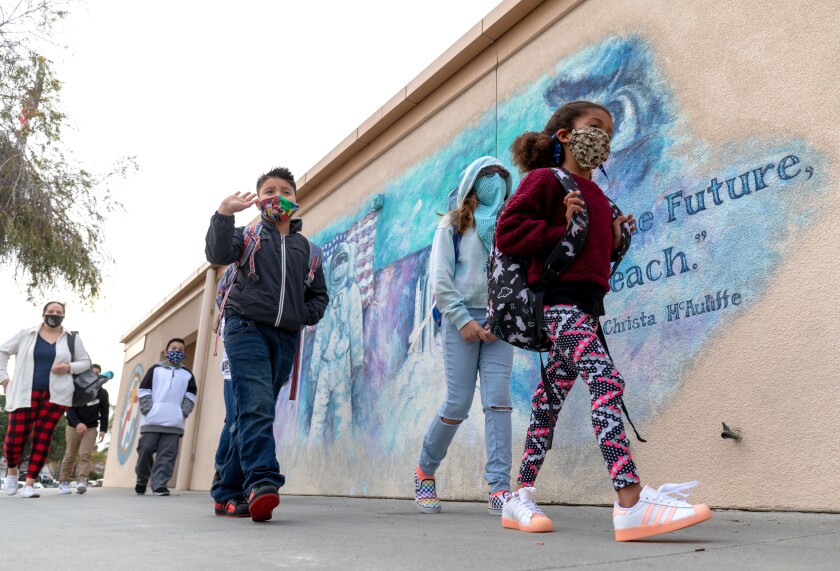 Students of McAuliffe Elementary School in Oceanside Unified School District go to class in a line.