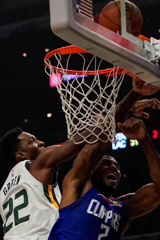 Utah Jazz forward Jeff Green blocks a shot by Clippers star Kawhi Leonard.