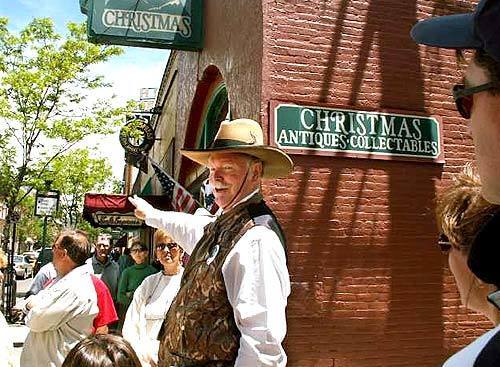 Retired judge and local fixture Richard Mangum captures the spirit of an earlier era as he leads a tour through the gentrified downtown of Flagstaff, Ariz., a ranching and railroad city settled around 1880.