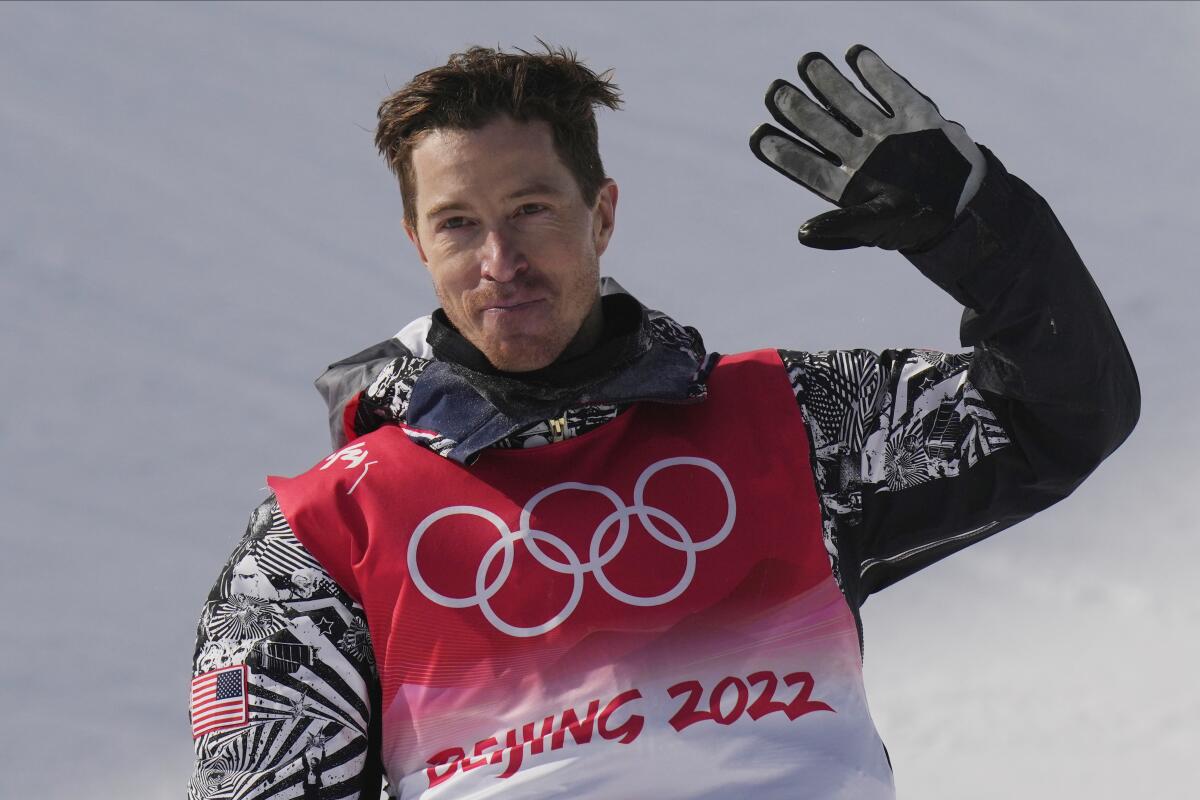 Shaun White waves after his final run in the men’s snowboard halfpipe final at the Beijing Olympics on Friday.