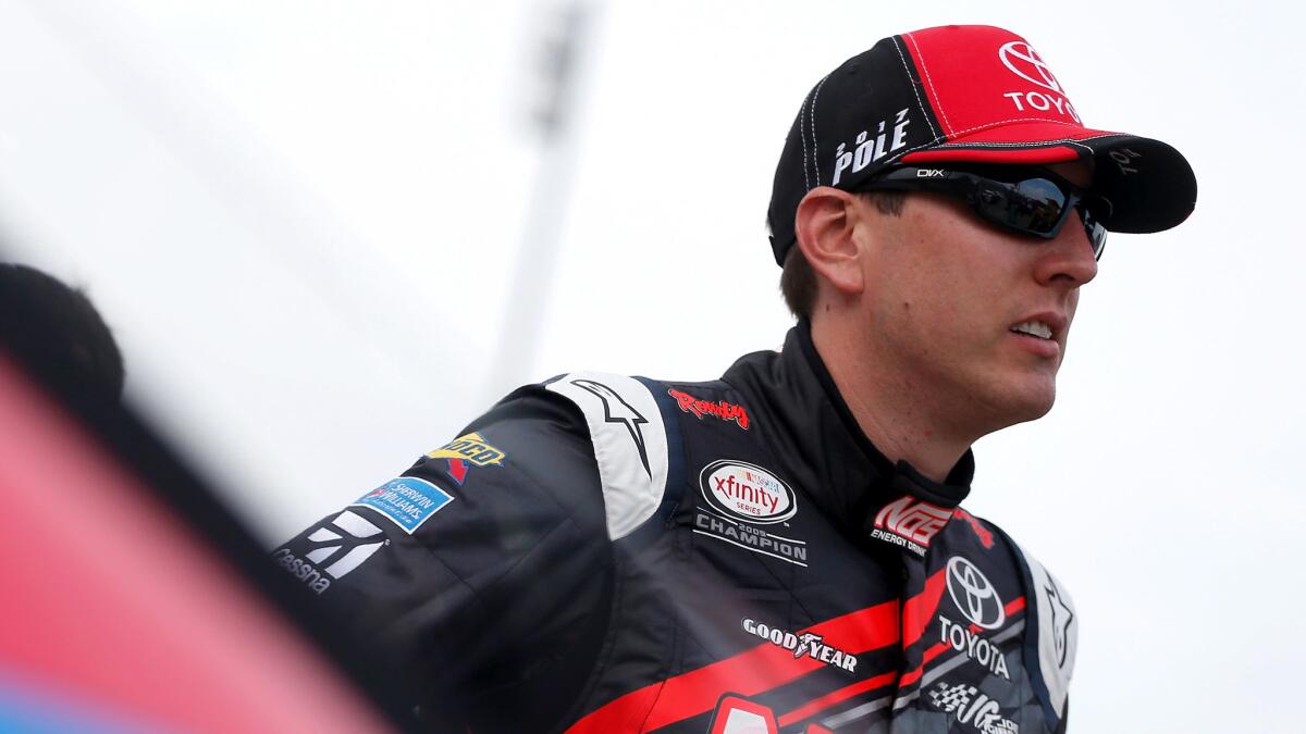 NASCAR driver Kyle Busch waits his turn for qualifying at Kentucky Speedway on Friday.