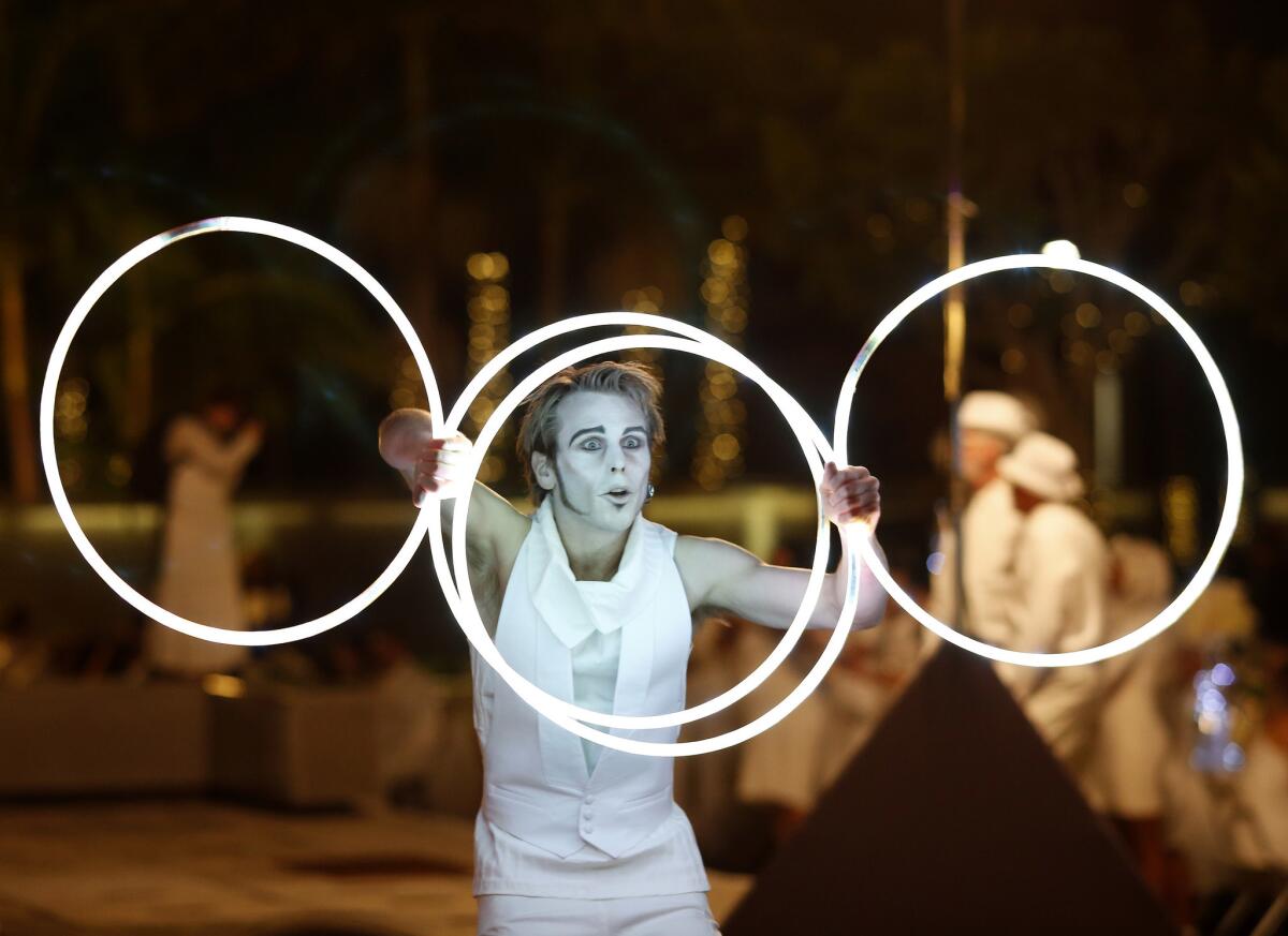 A performer entertains during Diner en Blanc 2016 in downtown Los Angeles.