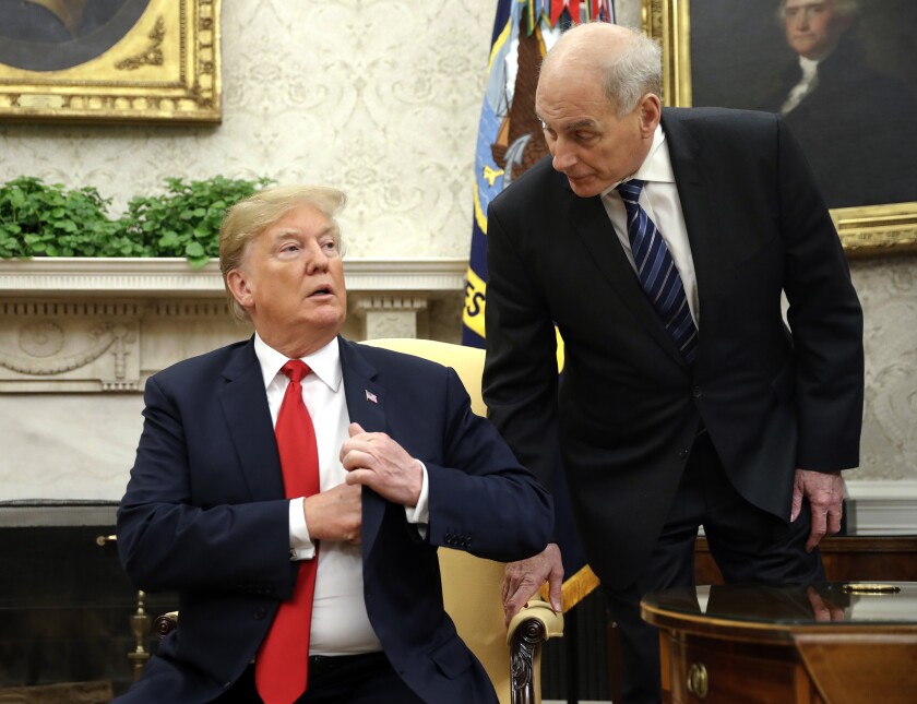 President Trump on Thursday lashed out against former White House Chief of Staff John Kelly, shown here with Trump in 2018, for being disloyal after the ex-advisor came to the defense of a former national security aide who offered key testimony in the impeachment inquiry.