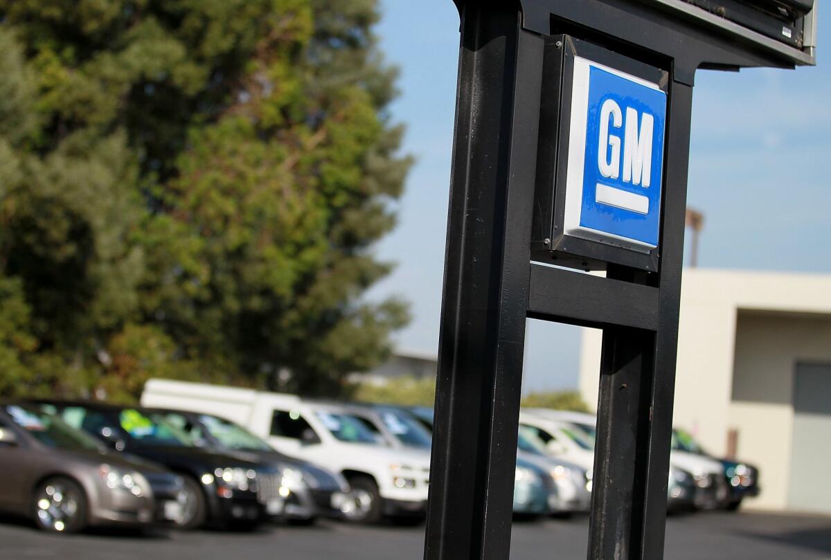 Vehicle sales for 2015 are expected to set a new U.S. record, as passenger car purchases rose above the 17.5 million mark/. In this photo, the General Motors logo is displayed at Boardwalk Chevrolet in Redwood City, California.