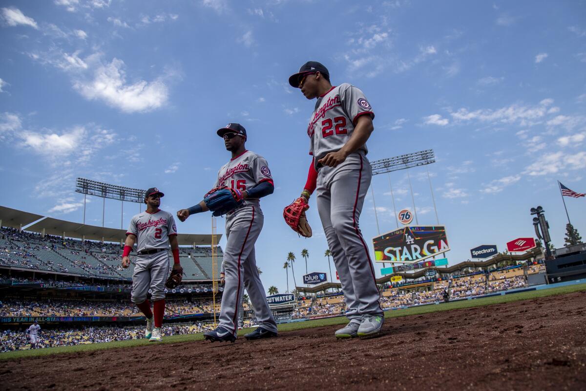 Washington Nationals right fielder Juan Soto (22) walks back to the dugout.