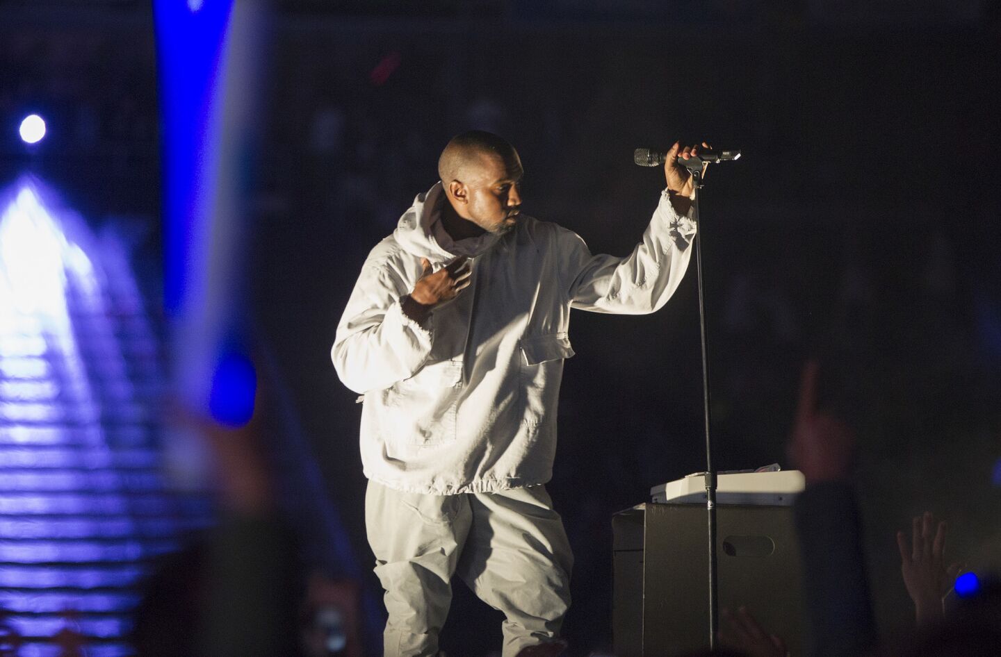 Kanye West performs in shadowy lights during the Wango Tango concert at the StubHub Center on May 9, 2105, in Carson.