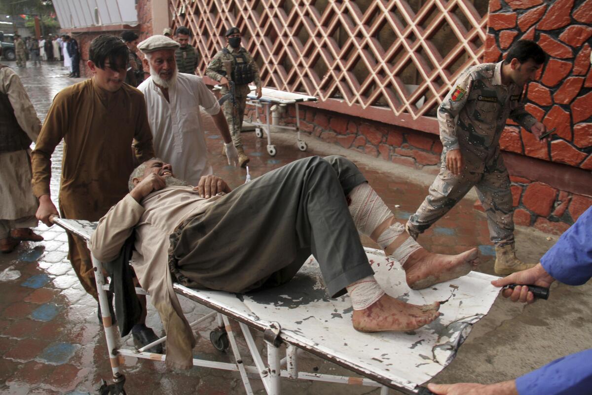A wounded man is brought into a hospital in Jalalabad