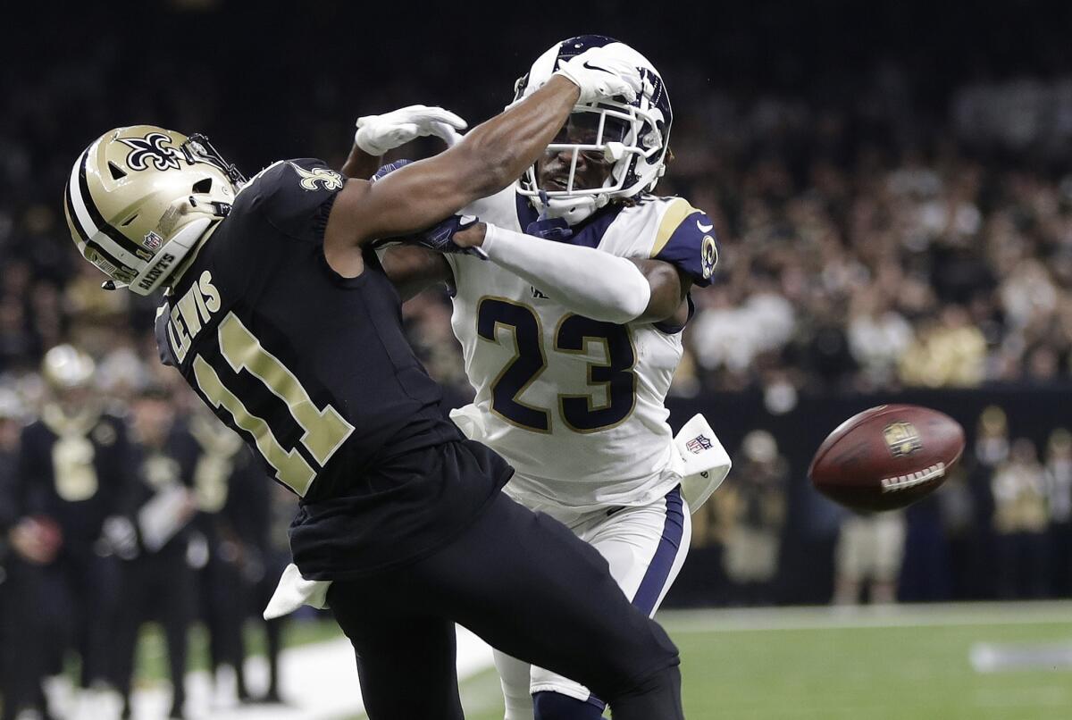 Rams cornerback Nickell Robey-Coleman makes contact with New Orleans Saints wide receiver TommyLee Lewis on a key pass during last year's NFC championship game.