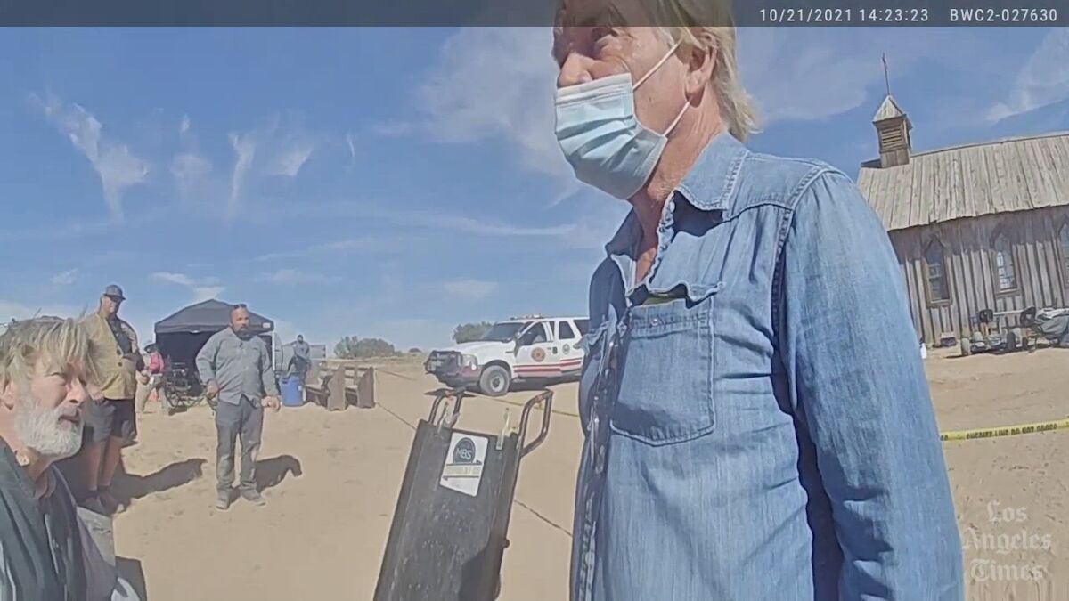 A still of a video shows man in a facemask on a ranch