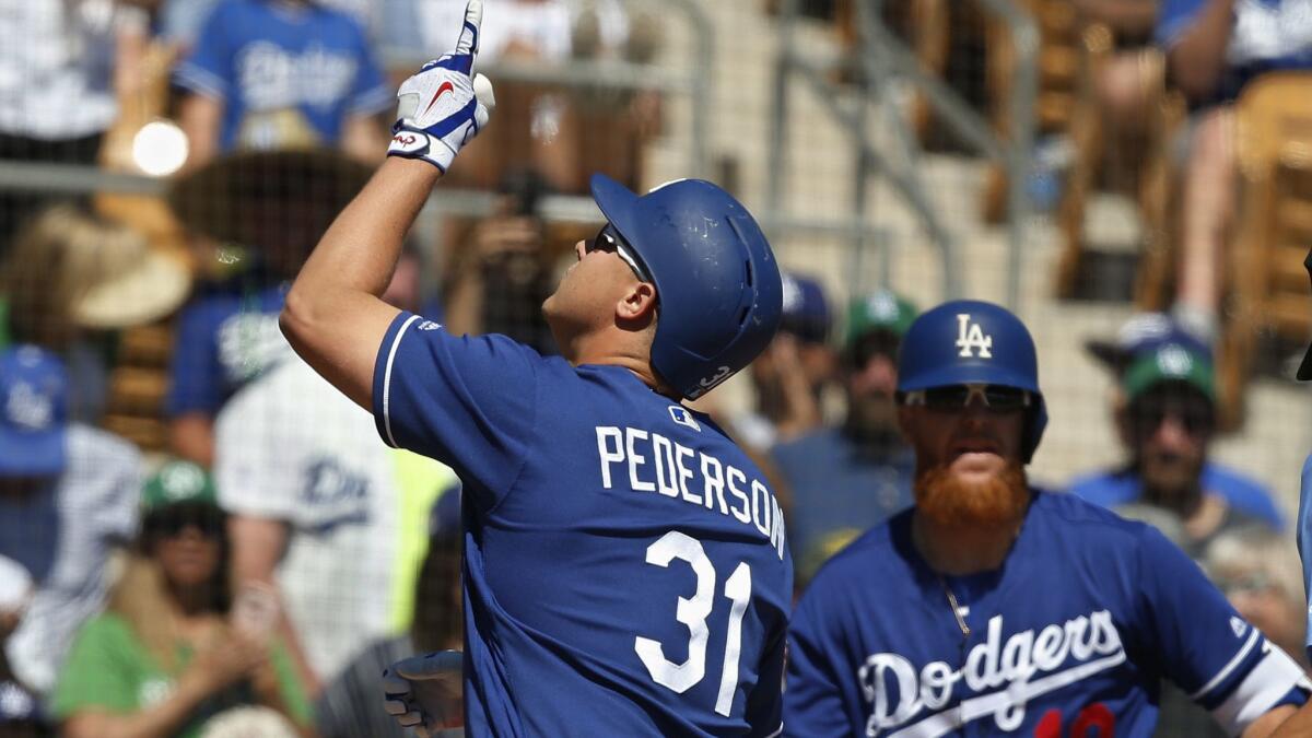 Dodgers outfielder Joc Pederson crosses home plate after hitting a leadoff home run against the Brewers on Sunday.