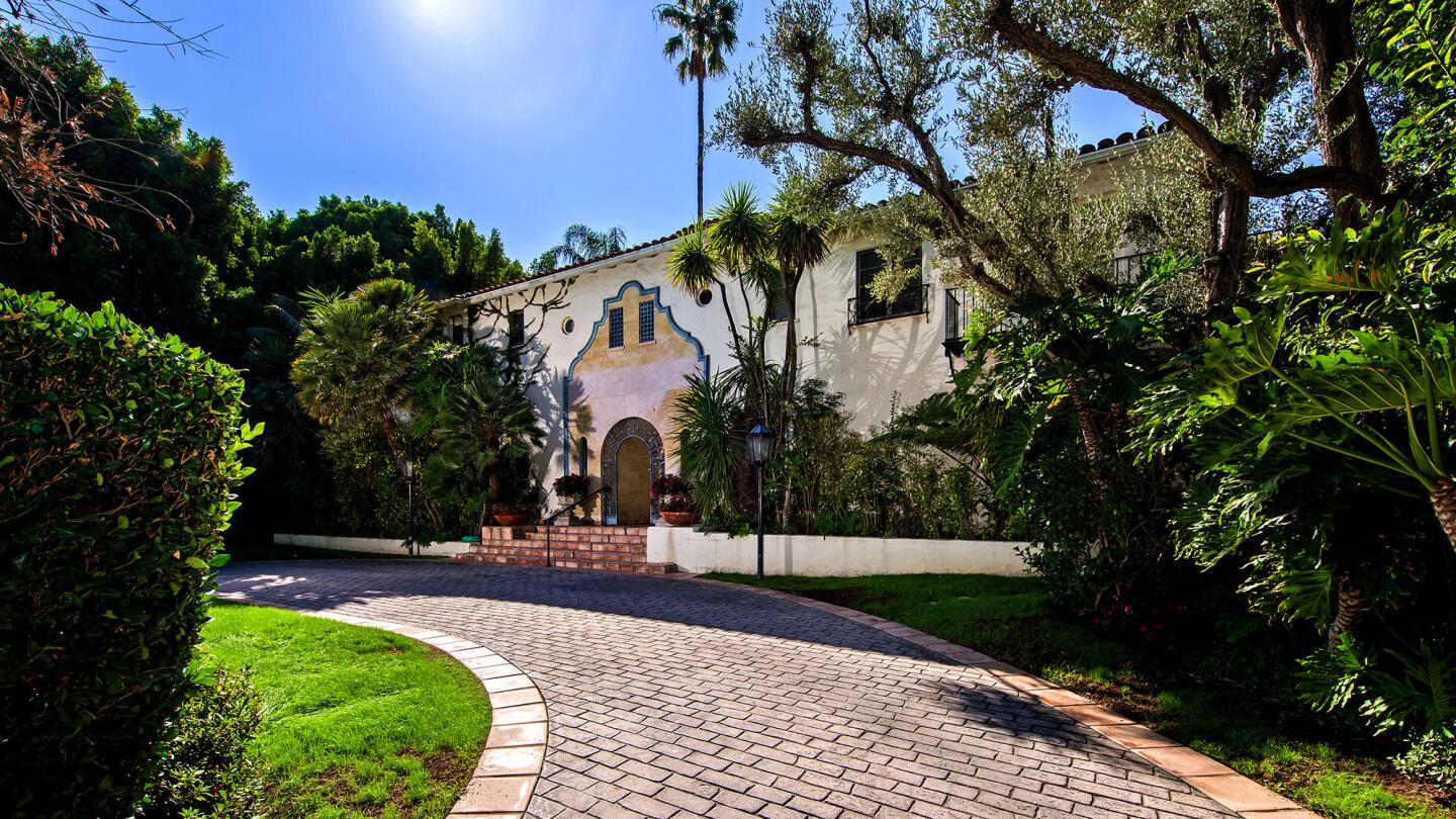 The longtime Beverly Hills home of Arnold Kopelson, the late producer of such films as "Platoon," is for sale at $13.5 million.