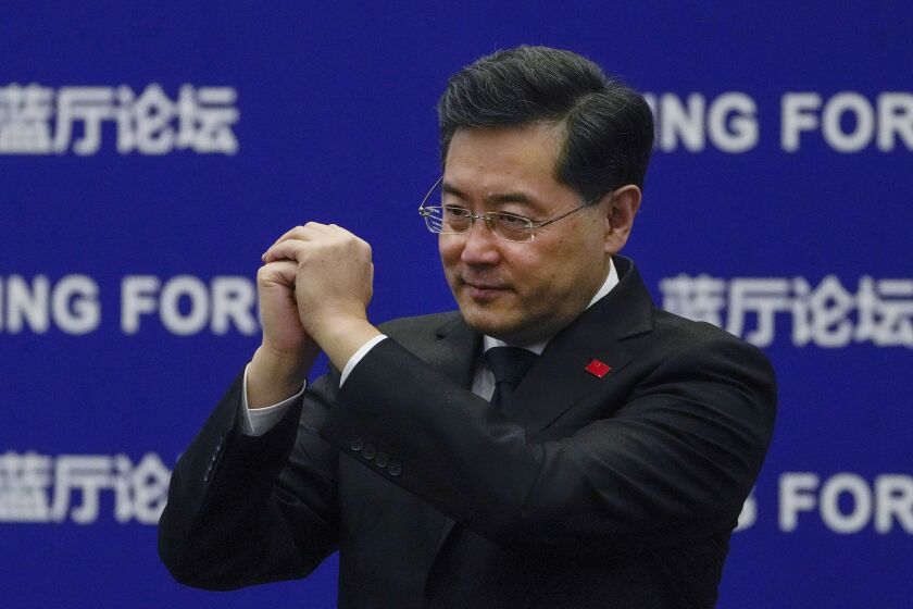 Chinese Foreign Minister Qin Gang gestures to delegations as he arrives at the Lanting Forum on the Global Security Initiative: China's Proposal for Solving Security Challenges held at the Ministry of Foreign Affairs office in Beijing, Tuesday, Feb. 21, 2023. Qin Gang on Tuesday expressed concerns about the rising tensions in Ukraine and said China was ready to provide "Chinese wisdom" for the political settlement of the crisis through dialogues. (AP Photo/Andy Wong)