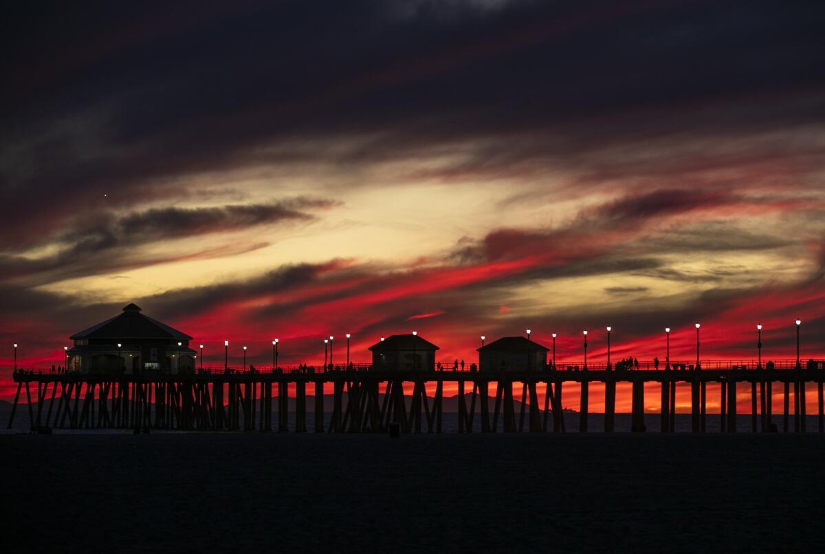The sun sets over the Huntington Beach Pier in November 2022. 