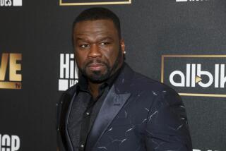 Curtis "50 Cent" Jackson in black suit at the 2022 premiere of "Hip Hop Homicides" at the Crosby Street Hotel in New York