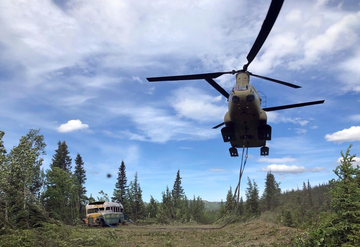 Alaska Army National Guard soldiers use a helicopter to remove the abandoned bus where Christopher McCandless died in 1992.