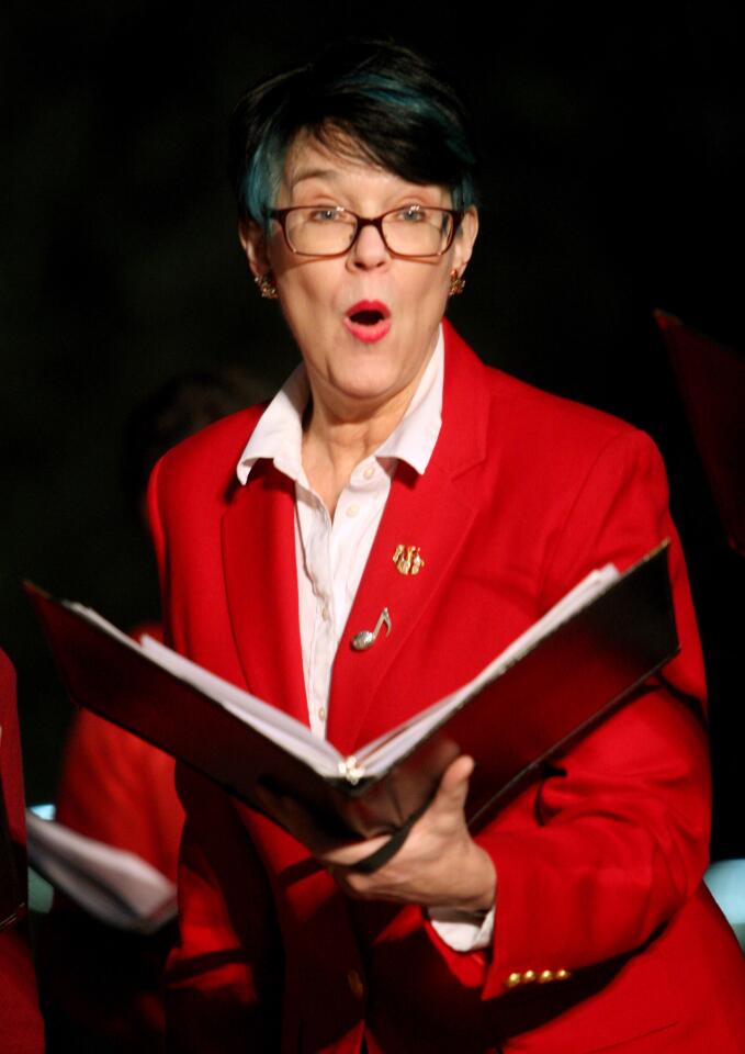 Nestlé Choir member Francey Welker sang Christmas songs at the tree lighting ceremony at Perkins Plaza in Glendale on Wednesday, Dec. 2, 2015.