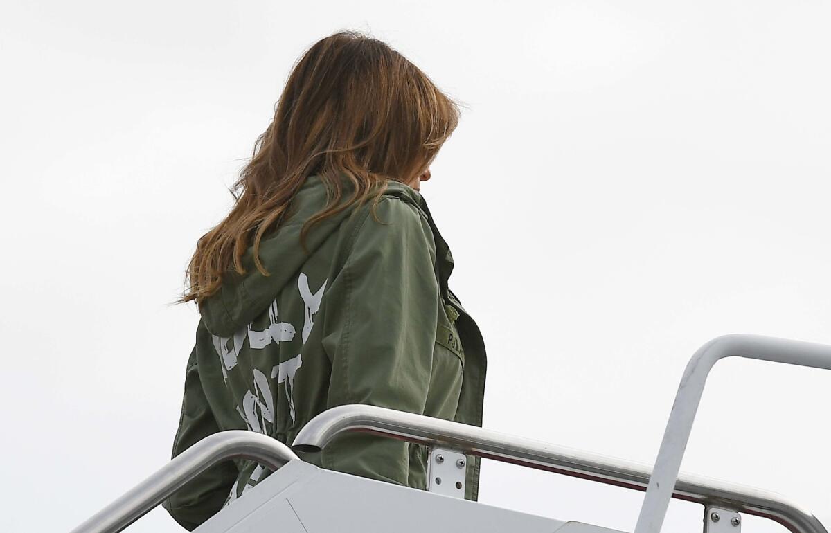 Melania Trump boards a flight in June 2018 wearing a jacket that reads: "I really don't care. Do U?" in white lettering.