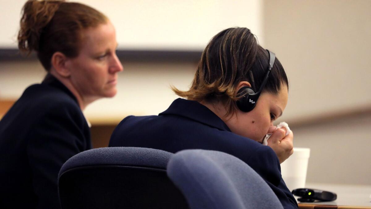 Esteysi “Stacy” Sanchez, right, cries during closing arguments in her trial in San Diego. She faces 15 years to life in prison for killing a homeless man in Oceanside in 2016 when driving drunk.