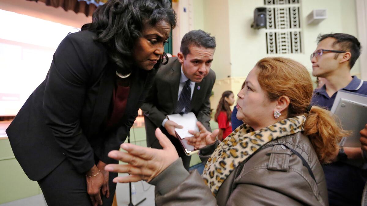 L.A. Unified Supt. Michelle King listens to parents' concerns following a town hall at Nightingale Middle School in the Cypress Park neighborhood of Los Angeles on May 25. She and the board want to have more say over how state dollars are spent.