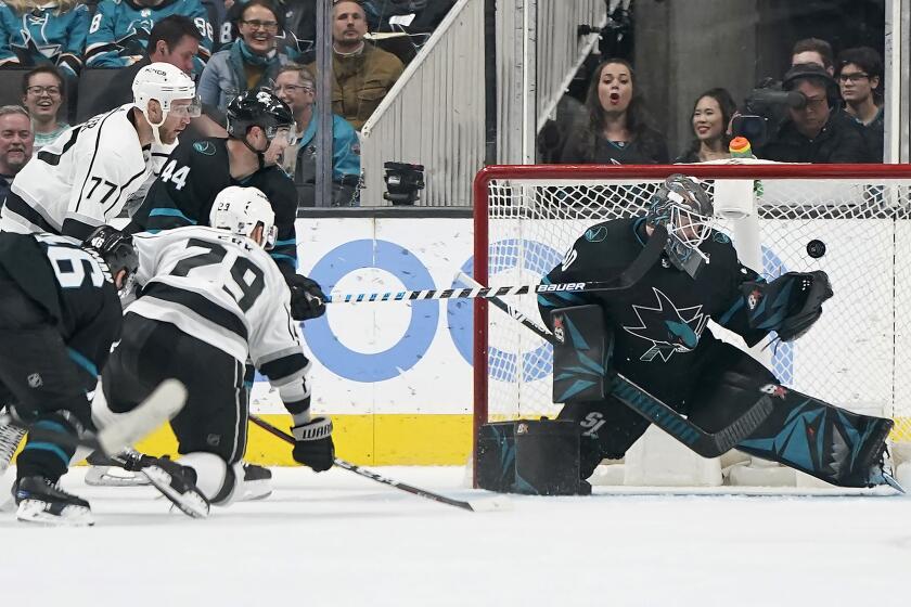 Los Angeles Kings' Martin Frk (29) scores a goal past San Jose Sharks goaltender Aaron Dell (30) during the third period of an NHL hockey game in San Jose, Calif., Friday, Dec. 27, 2019. The Kings won 3-2 in overtime. (AP Photo/Tony Avelar)