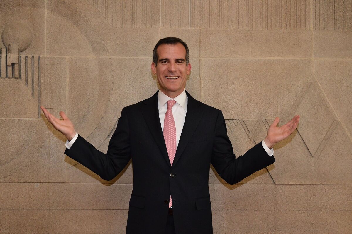 Mayor Eric Garcetti attends the ribbon-cutting ceremony for the re-opening of the Frank Lloyd Wright Hollyhock House on Feb. 13. Despite being a year and a half into his first term, Garcetti still hasn't taken strong positions on many of the region's most divisive issues.