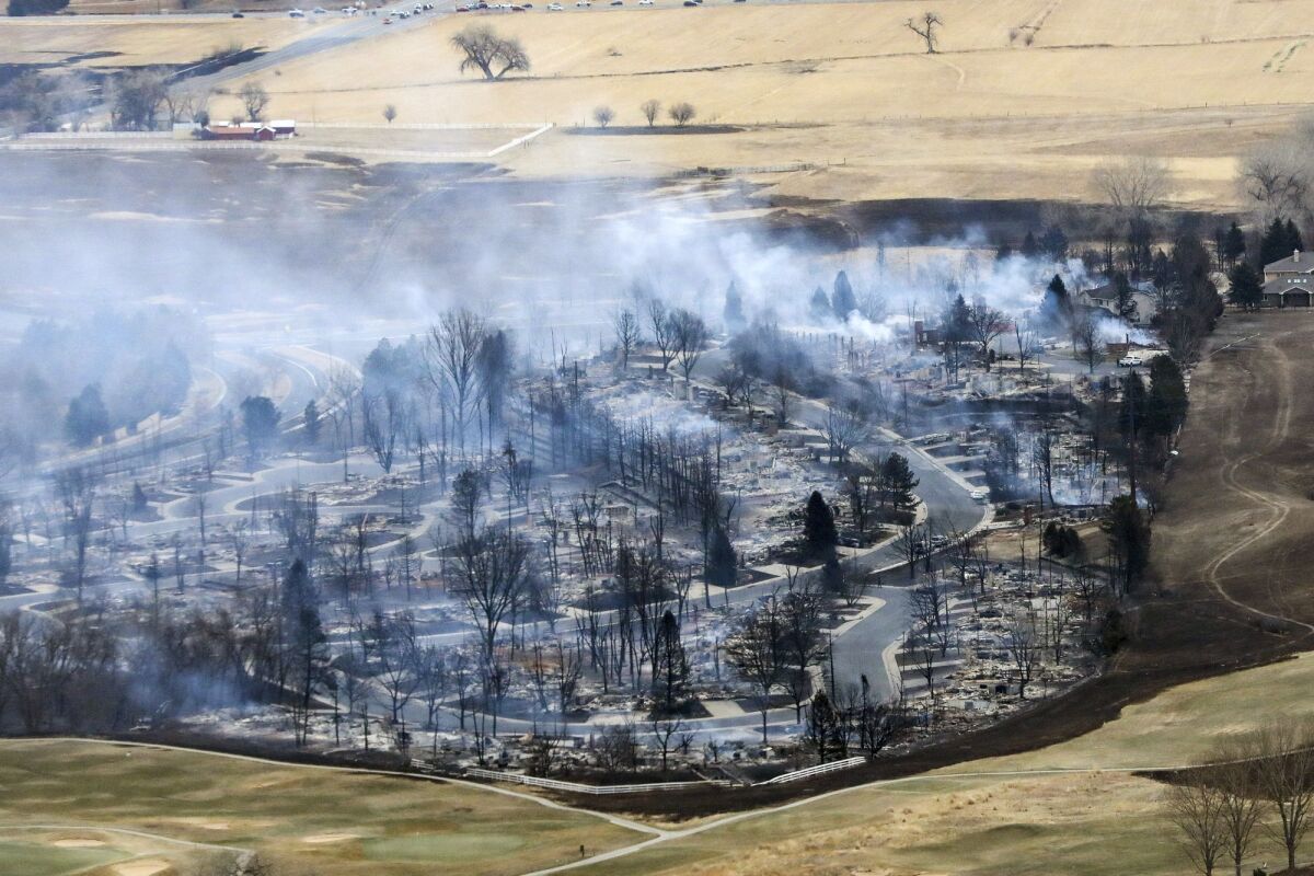 Smoldering neighborhood after wildfire