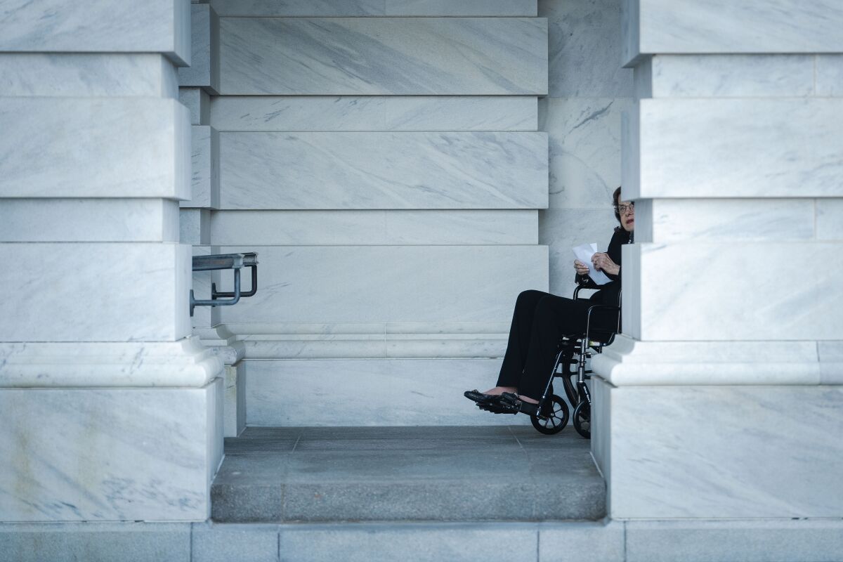 Feinstein in a wheelchair.