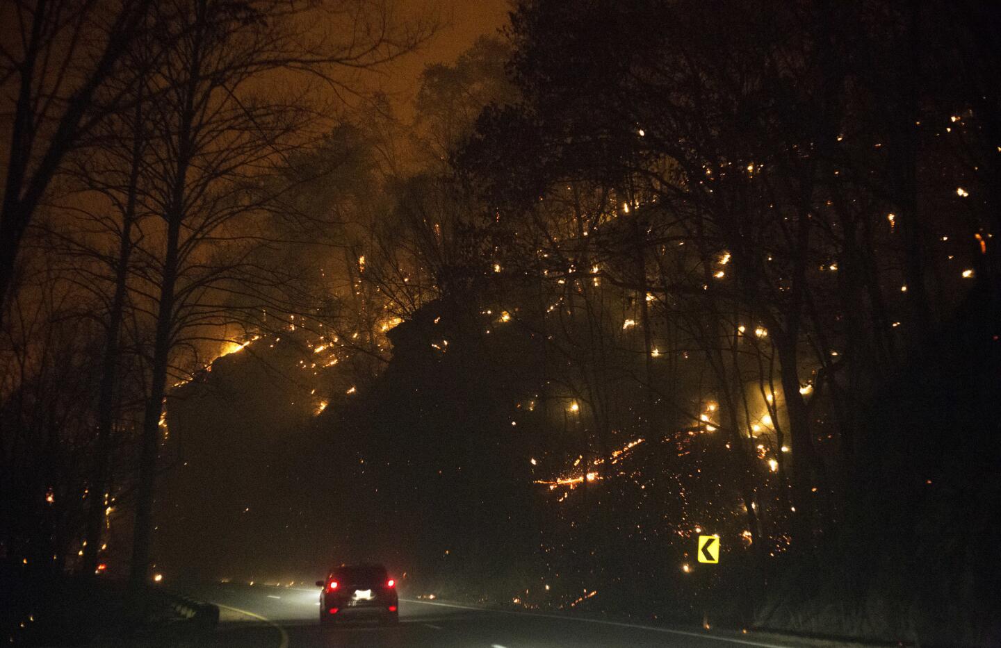 Fire erupts on both sides of Highway 441 between Gatlinburg and Pigeon Forge, Tenn., on Nov. 28, 2016.