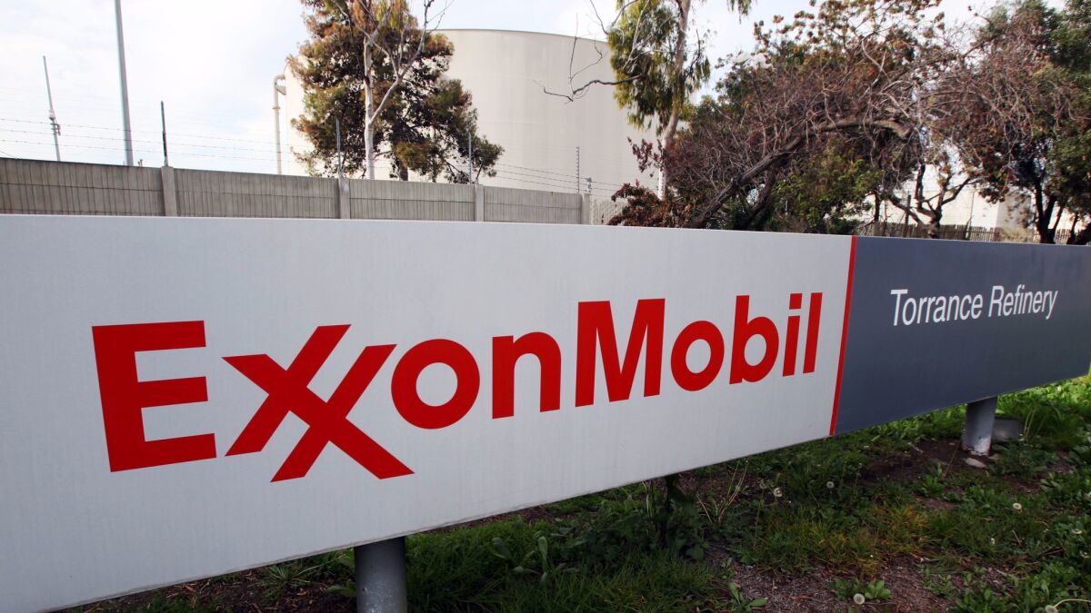 A photo taken Jan. 30, 2012, shows the sign outside an oil refinery facility in Torrance, Calif. that until this year was owned by Exxon Mobil. The plant was sold for $537.5-million to New Jersey-based PBF Energy.