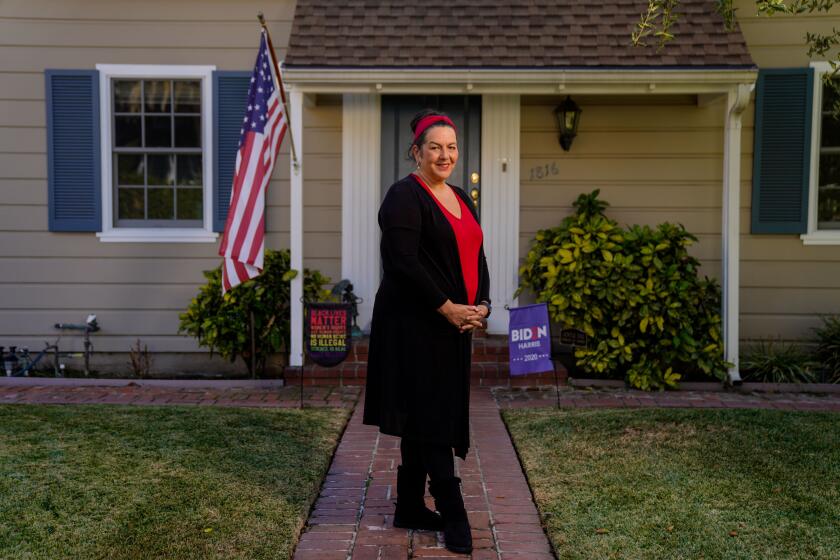 GLENDALE, CA - DECEMBER 16: Educator Lisa Bennett poses for a portrait outside her home on Wednesday, Dec. 16, 2020 in Glendale, CA. A coalition of unions, representing teachers, hotel workers, nurses, college health care workers and others, is calling for an economic shutdown in January, including all restaurant service, to slam the door on COVID-19 and make for a safe reopening of campuses and businesses in February. (Kent Nishimura / Los Angeles Times)