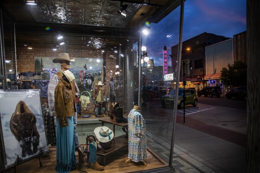 CASPER, WY - JUNE 10, 2022: A country and western clothing store faces the main downtown street as dusk falls on this Republican stronghold on June 10, 2022 in Casper, Wyoming.(Gina Ferazzi / Los Angeles Times)