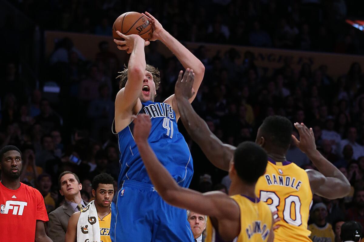 Mavericks forward Dirk Nowitzki hits the game-winning shot over Lakers forward Julius Randle during the fourth quarter of a game at Staples Center on Jan. 26.
