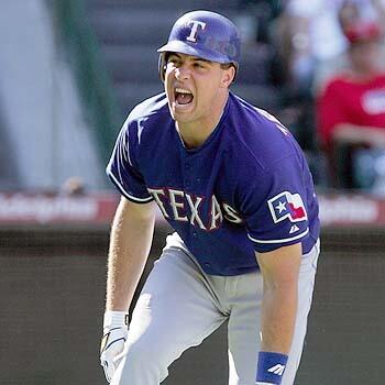 HURTING: Mark Teixeira of the Texas Rangers grimaces after being hit on a foot by a pitch in the ninth inning.